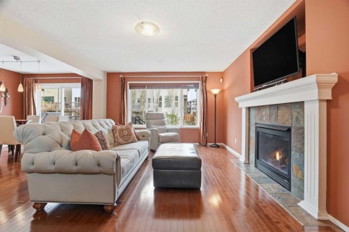 56 Everglen Way Sw, Calgary, AB - Indoor Photo Showing Living Room With Fireplace