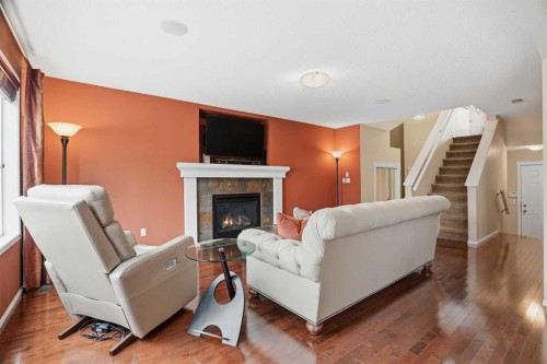 56 Everglen Way Sw, Calgary, AB - Indoor Photo Showing Living Room With Fireplace
