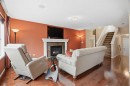 56 Everglen Way Sw, Calgary, AB  - Indoor Photo Showing Living Room With Fireplace 