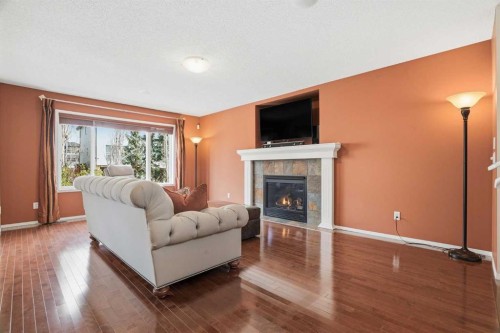56 Everglen Way Sw, Calgary, AB - Indoor Photo Showing Living Room With Fireplace