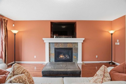 56 Everglen Way Sw, Calgary, AB - Indoor Photo Showing Living Room With Fireplace