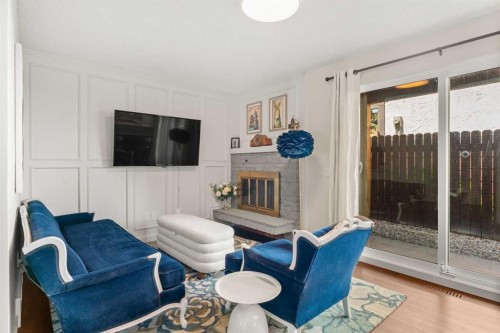 263 Silvergrove Place Nw, Calgary, AB - Indoor Photo Showing Other Room With Fireplace