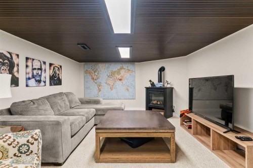 263 Silvergrove Place Nw, Calgary, AB - Indoor Photo Showing Living Room With Fireplace