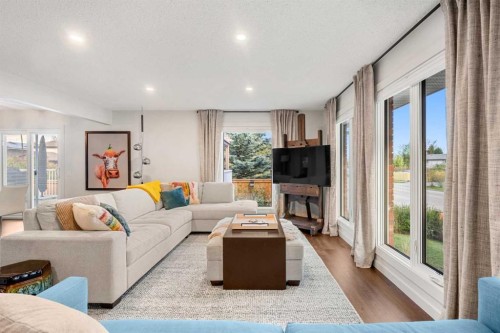 263 Silvergrove Place Nw, Calgary, AB - Indoor Photo Showing Living Room With Fireplace