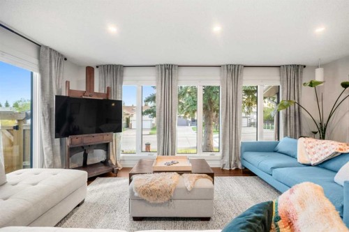 263 Silvergrove Place Nw, Calgary, AB - Indoor Photo Showing Living Room With Fireplace