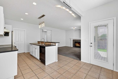53 Royal Birch Way Nw, Calgary, AB - Indoor With Fireplace