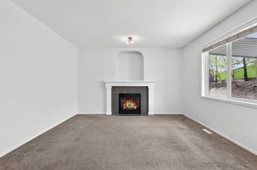 53 Royal Birch Way Nw, Calgary, AB - Indoor Photo Showing Living Room With Fireplace