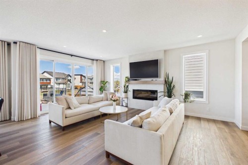 59 Royston Rise Nw, Calgary, AB - Indoor Photo Showing Living Room With Fireplace