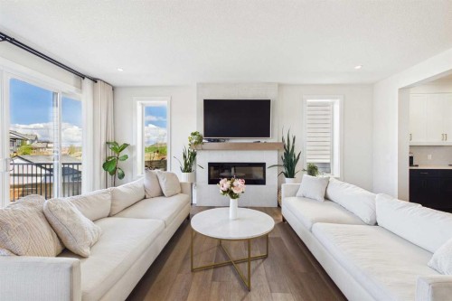 59 Royston Rise Nw, Calgary, AB - Indoor Photo Showing Living Room With Fireplace