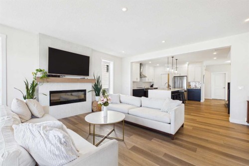 59 Royston Rise Nw, Calgary, AB - Indoor Photo Showing Living Room With Fireplace