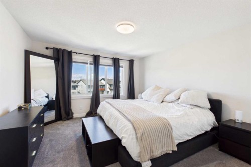 59 Royston Rise Nw, Calgary, AB - Indoor Photo Showing Bedroom