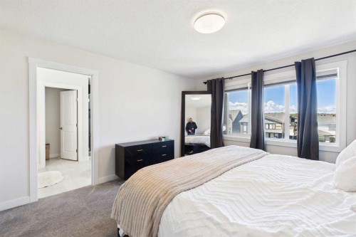 59 Royston Rise Nw, Calgary, AB - Indoor Photo Showing Bedroom