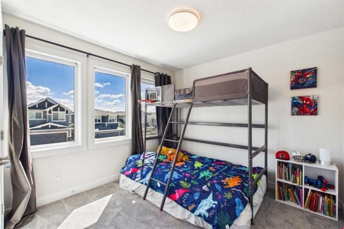 59 Royston Rise Nw, Calgary, AB - Indoor Photo Showing Bedroom