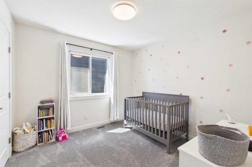 59 Royston Rise Nw, Calgary, AB - Indoor Photo Showing Bedroom