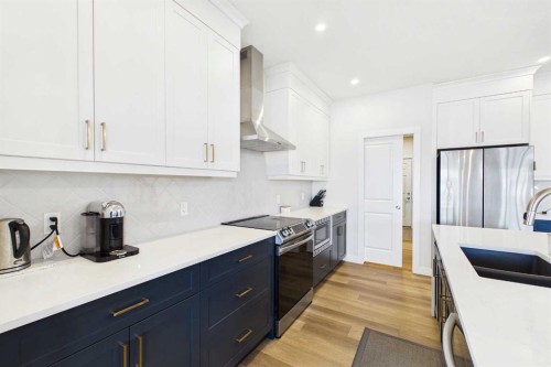 59 Royston Rise Nw, Calgary, AB - Indoor Photo Showing Kitchen With Upgraded Kitchen