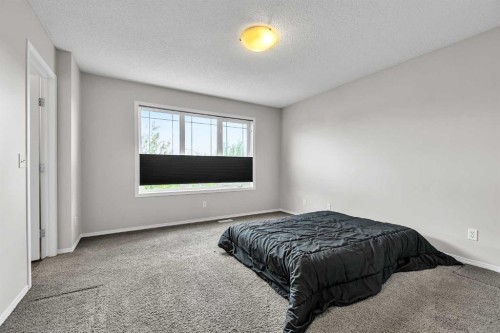 242 Copperstone Grove Se, Calgary, AB - Indoor Photo Showing Bedroom