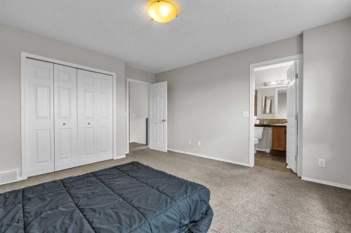 242 Copperstone Grove Se, Calgary, AB - Indoor Photo Showing Bedroom