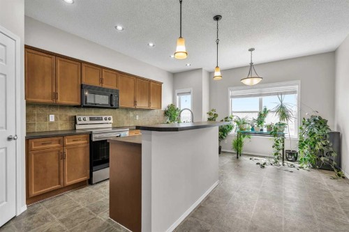242 Copperstone Grove Se, Calgary, AB - Indoor Photo Showing Kitchen With Upgraded Kitchen