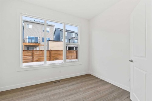 486 Lucas Way Nw, Calgary, AB - Indoor Photo Showing Other Room