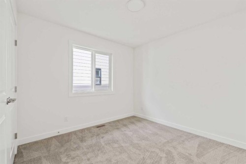 486 Lucas Way Nw, Calgary, AB - Indoor Photo Showing Other Room