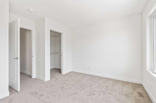 486 Lucas Way Nw, Calgary, AB - Indoor Photo Showing Other Room