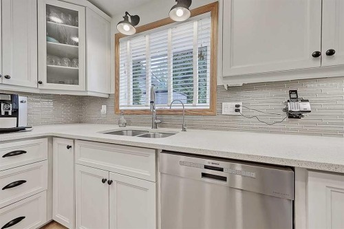 42 Sundown Close Se, Calgary, AB - Indoor Photo Showing Kitchen With Double Sink With Upgraded Kitchen