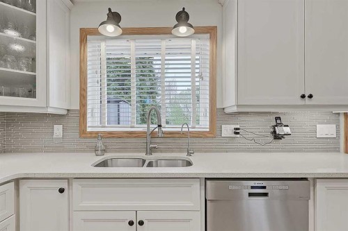 42 Sundown Close Se, Calgary, AB - Indoor Photo Showing Kitchen With Double Sink With Upgraded Kitchen