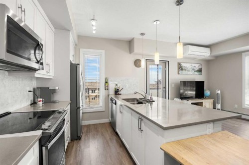 401-150 Auburn Meadows Manor Se, Calgary, AB - Indoor Photo Showing Kitchen With Double Sink With Upgraded Kitchen