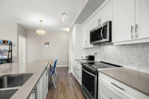 401-150 Auburn Meadows Manor Se, Calgary, AB - Indoor Photo Showing Kitchen With Upgraded Kitchen
