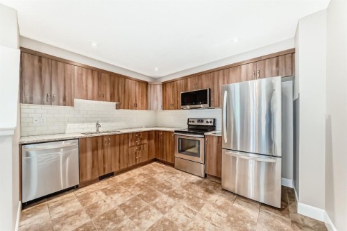 553 Windstone Common Sw, Airdrie, AB - Indoor Photo Showing Kitchen With Stainless Steel Kitchen
