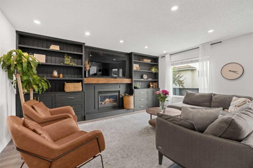 116 Cove Road, Chestermere, AB - Indoor Photo Showing Living Room With Fireplace
