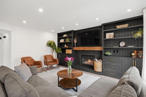 116 Cove Road, Chestermere, AB - Indoor Photo Showing Living Room With Fireplace