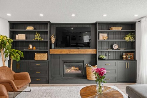 116 Cove Road, Chestermere, AB - Indoor Photo Showing Living Room With Fireplace
