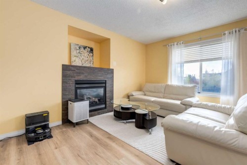 324 Evermeadow Road Sw, Calgary, AB - Indoor Photo Showing Living Room With Fireplace