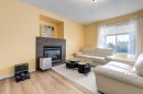 324 Evermeadow Road Sw, Calgary, AB  - Indoor Photo Showing Living Room With Fireplace 