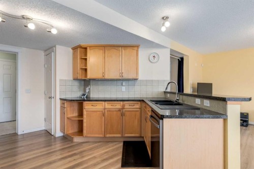 324 Evermeadow Road Sw, Calgary, AB - Indoor Photo Showing Kitchen With Double Sink