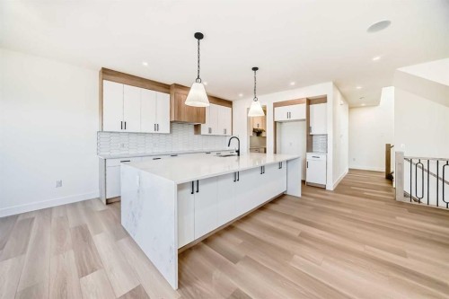 407 Rivercrest Road, Cochrane, AB - Indoor Photo Showing Kitchen With Upgraded Kitchen