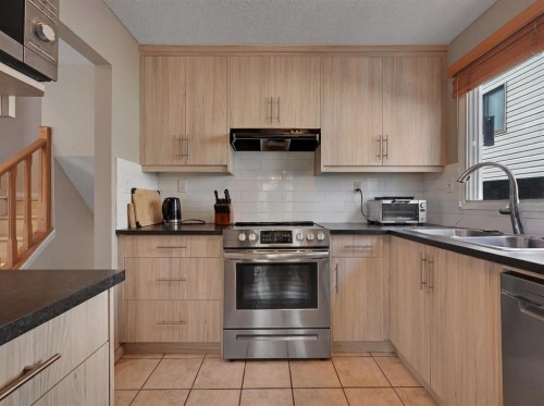 160 Strathcona Close Sw, Calgary, AB - Indoor Photo Showing Kitchen With Double Sink