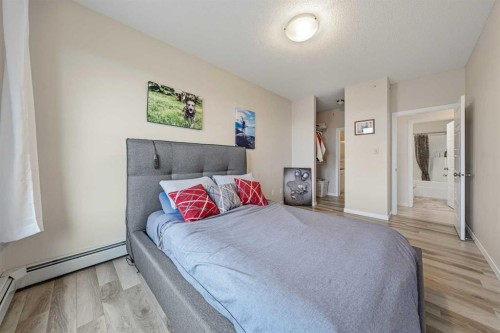 404-207 Sunset Drive, Cochrane, AB - Indoor Photo Showing Bedroom