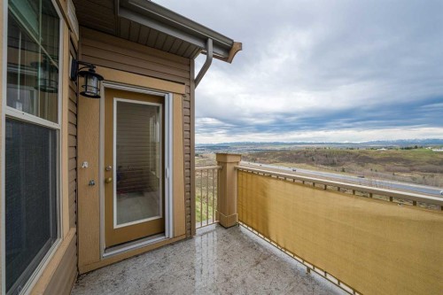 404-207 Sunset Drive, Cochrane, AB - Outdoor With Balcony