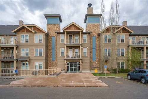 404-207 Sunset Drive, Cochrane, AB - Outdoor With Balcony With Facade