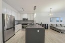 404-207 Sunset Drive, Cochrane, AB  - Indoor Photo Showing Kitchen With Double Sink 