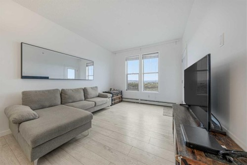 404-207 Sunset Drive, Cochrane, AB - Indoor Photo Showing Living Room