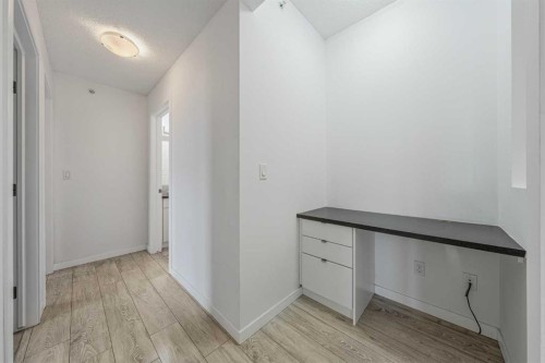 404-207 Sunset Drive, Cochrane, AB - Indoor Photo Showing Other Room