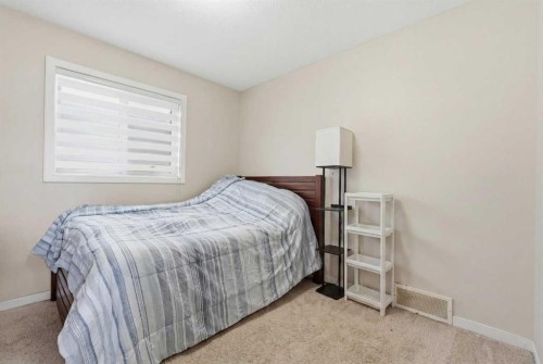 4 Panton Road Nw, Calgary, AB - Indoor Photo Showing Bedroom