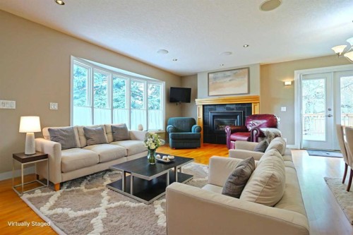 175 Brabourne Road Sw, Calgary, AB - Indoor Photo Showing Living Room With Fireplace