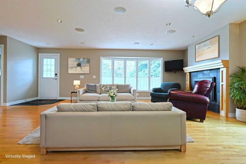 175 Brabourne Road Sw, Calgary, AB - Indoor Photo Showing Living Room With Fireplace