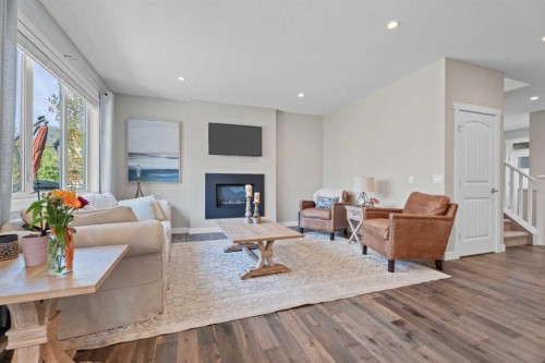 19 Masters Mews Se, Calgary, AB - Indoor Photo Showing Living Room With Fireplace