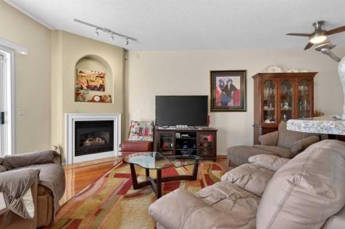 92 Hamptons Link Nw, Calgary, AB - Indoor Photo Showing Living Room With Fireplace