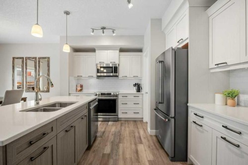 183 Kinniburgh Road, Chestermere, AB - Indoor Photo Showing Kitchen With Stainless Steel Kitchen With Double Sink With Upgraded Kitchen